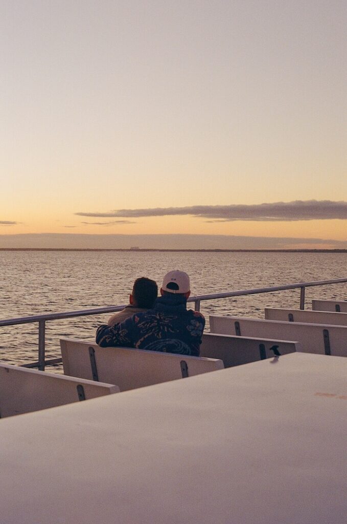 Couple watching the sunset over the Great South Bay from the Fire Island ferry.
